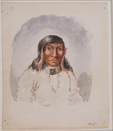 Male Indian with white bone running through his septum.